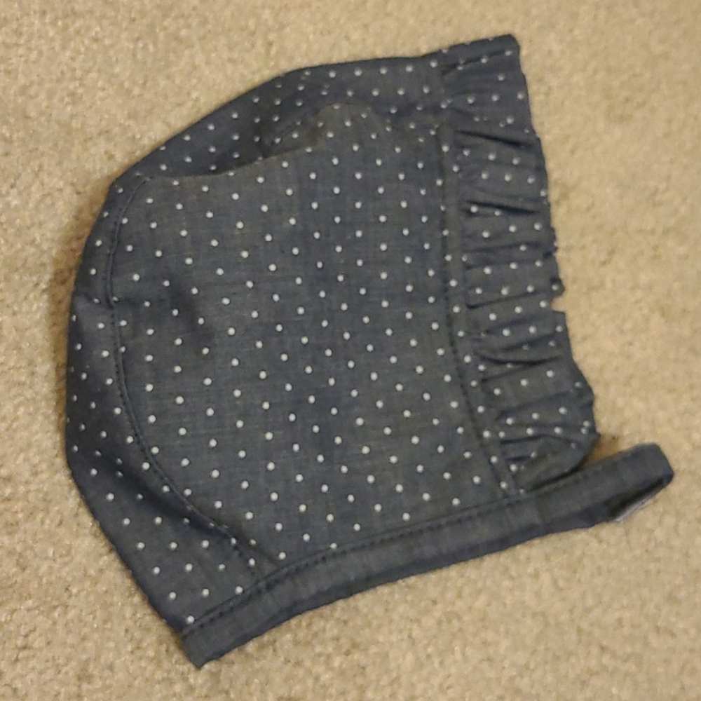 Baby bonnet with polka-dots.